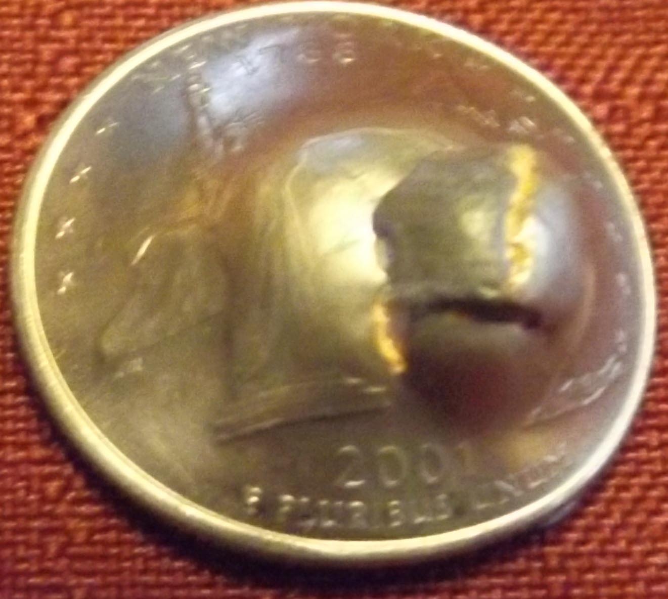Quarter-Shot-With-A-.22-Mag